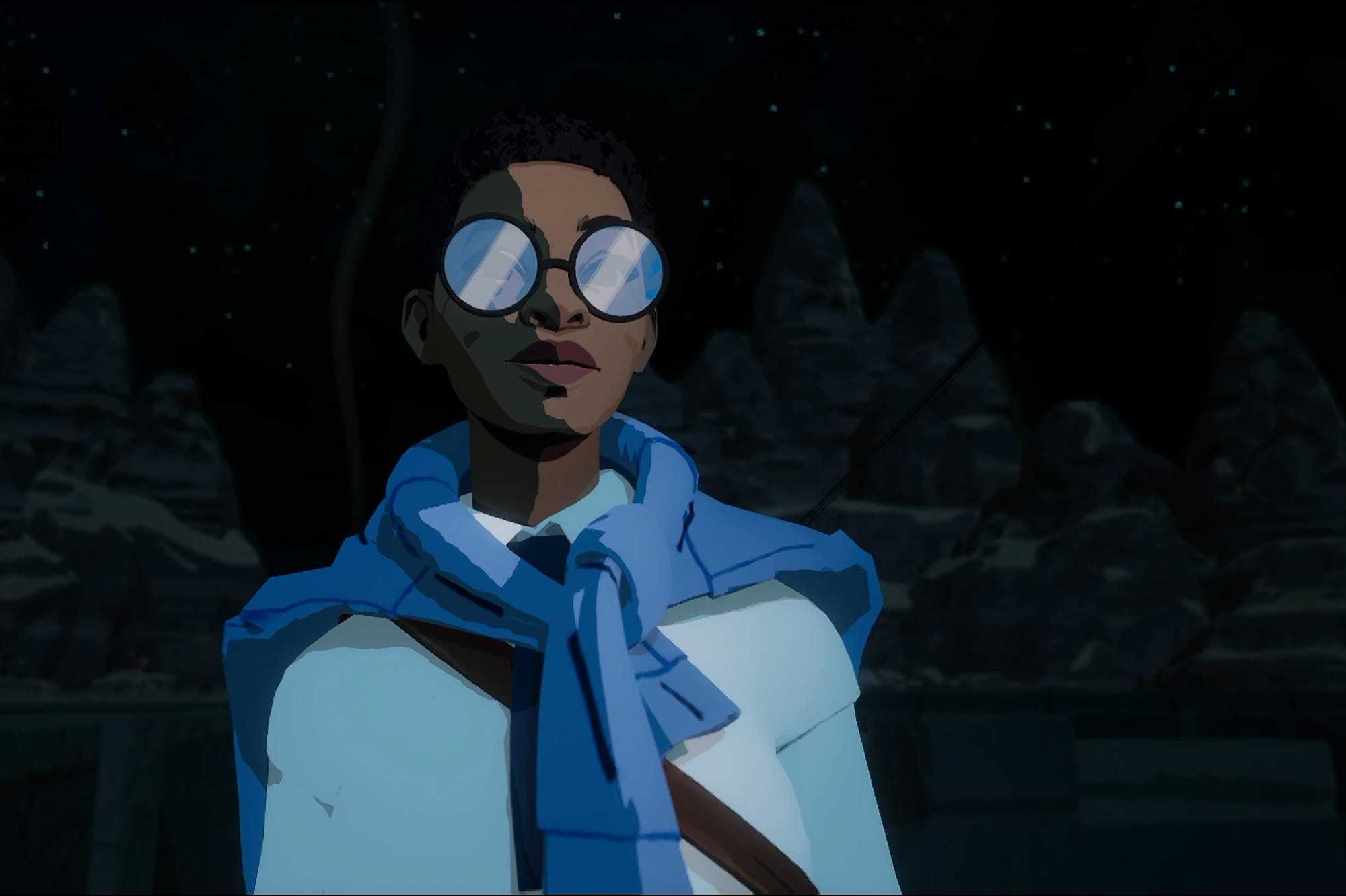 A screenshot from "Season" with a black woman with short hair and glasses looking at the camera.
