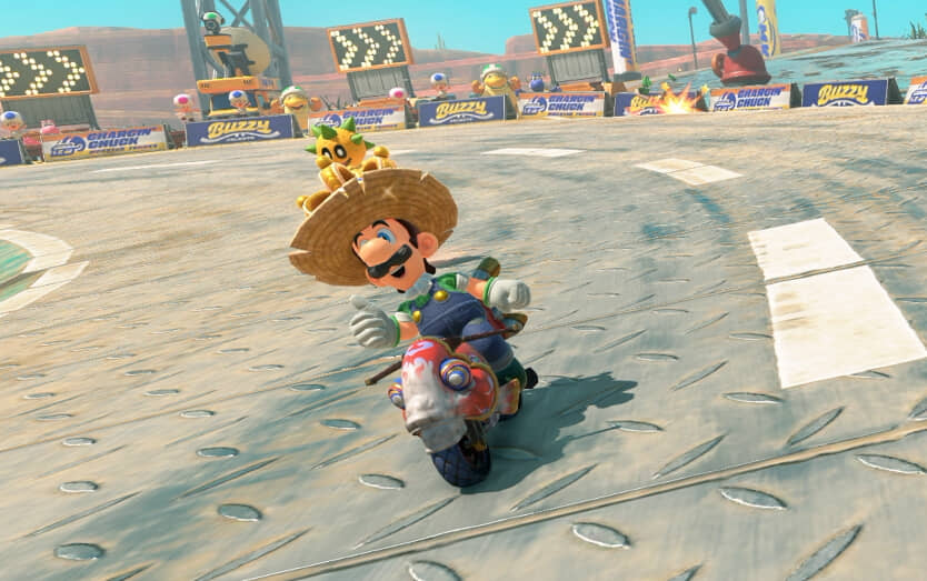 Luigi on a cart in a large farmer's hat.