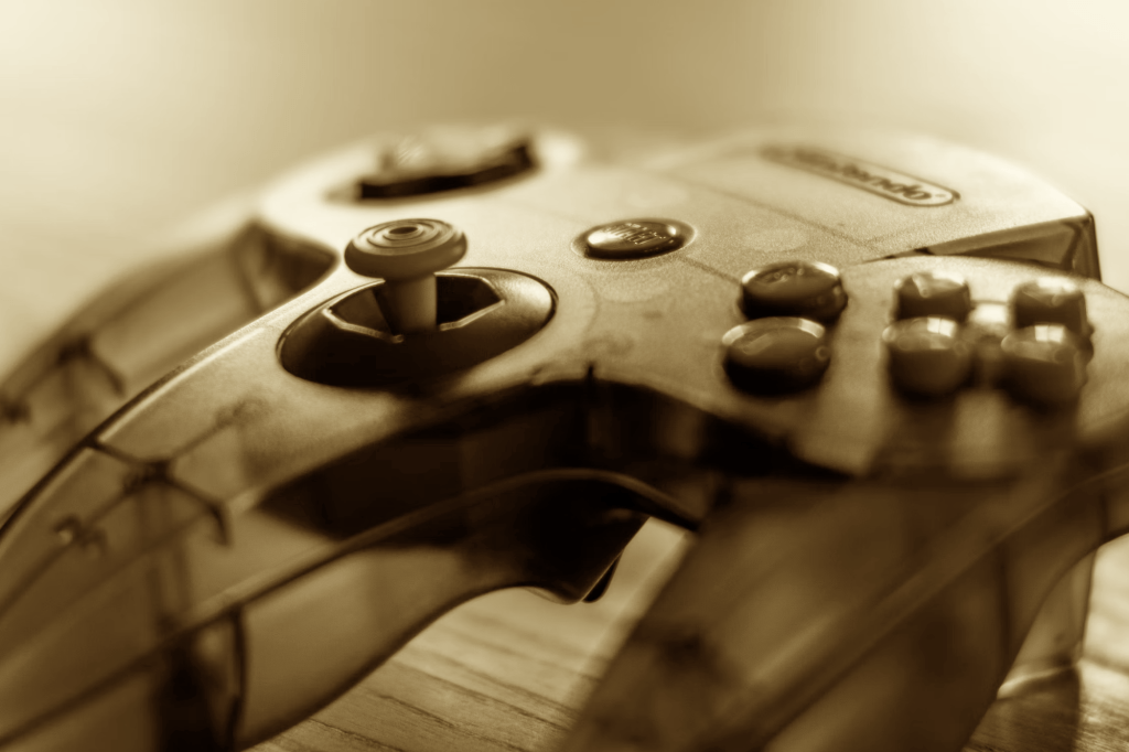 a sepiatone image of a Nintendo 64 controller