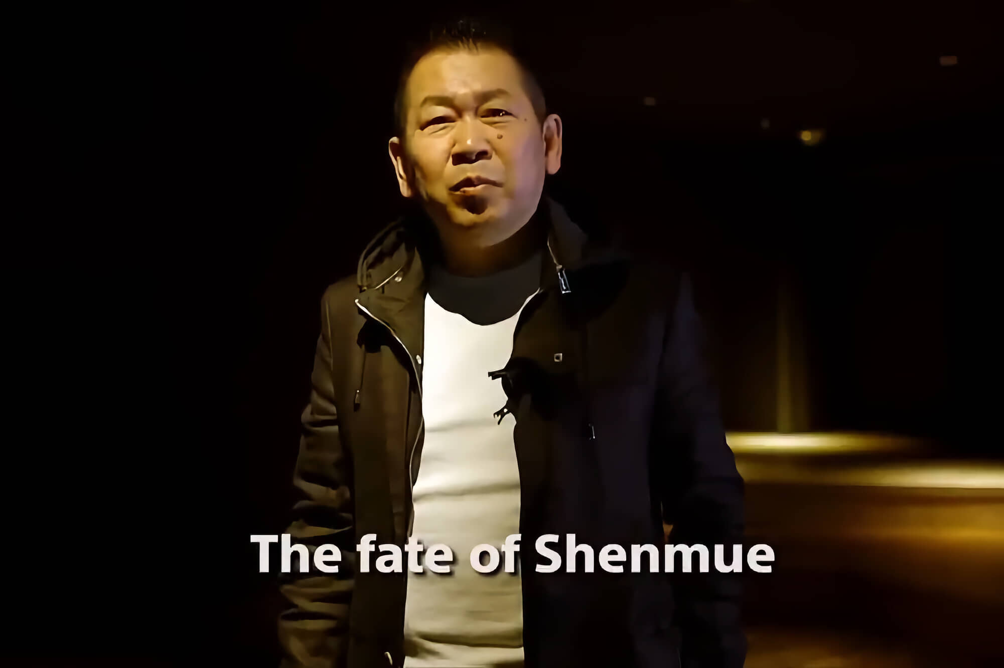 Yu Suzuki announcing the "Shenmue III" kickstarter. The text reads "The fate of Shenmue."