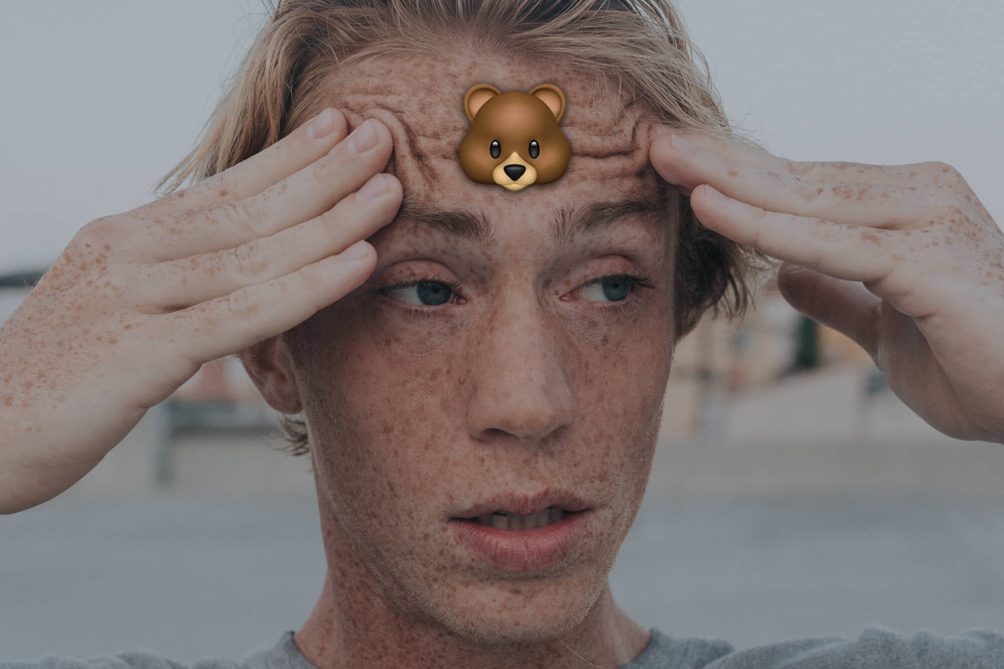 confused man with a bear on his forehead