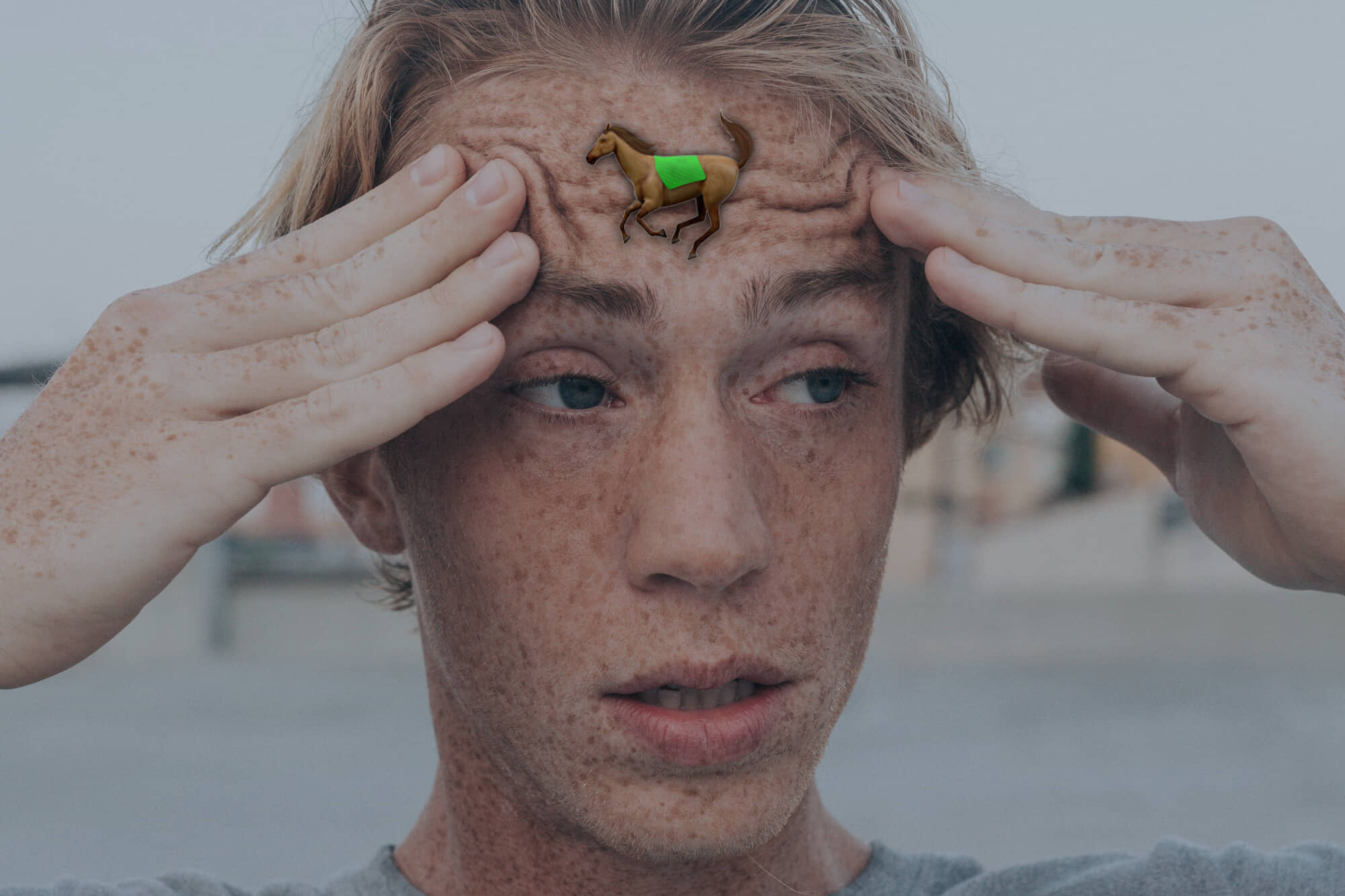 confused man with a horse on his forehead