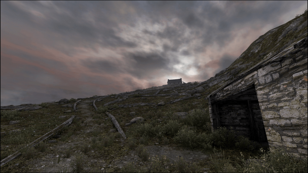 a screenshot from "Dear Esther" showing a small building on a hill and a dirt path.