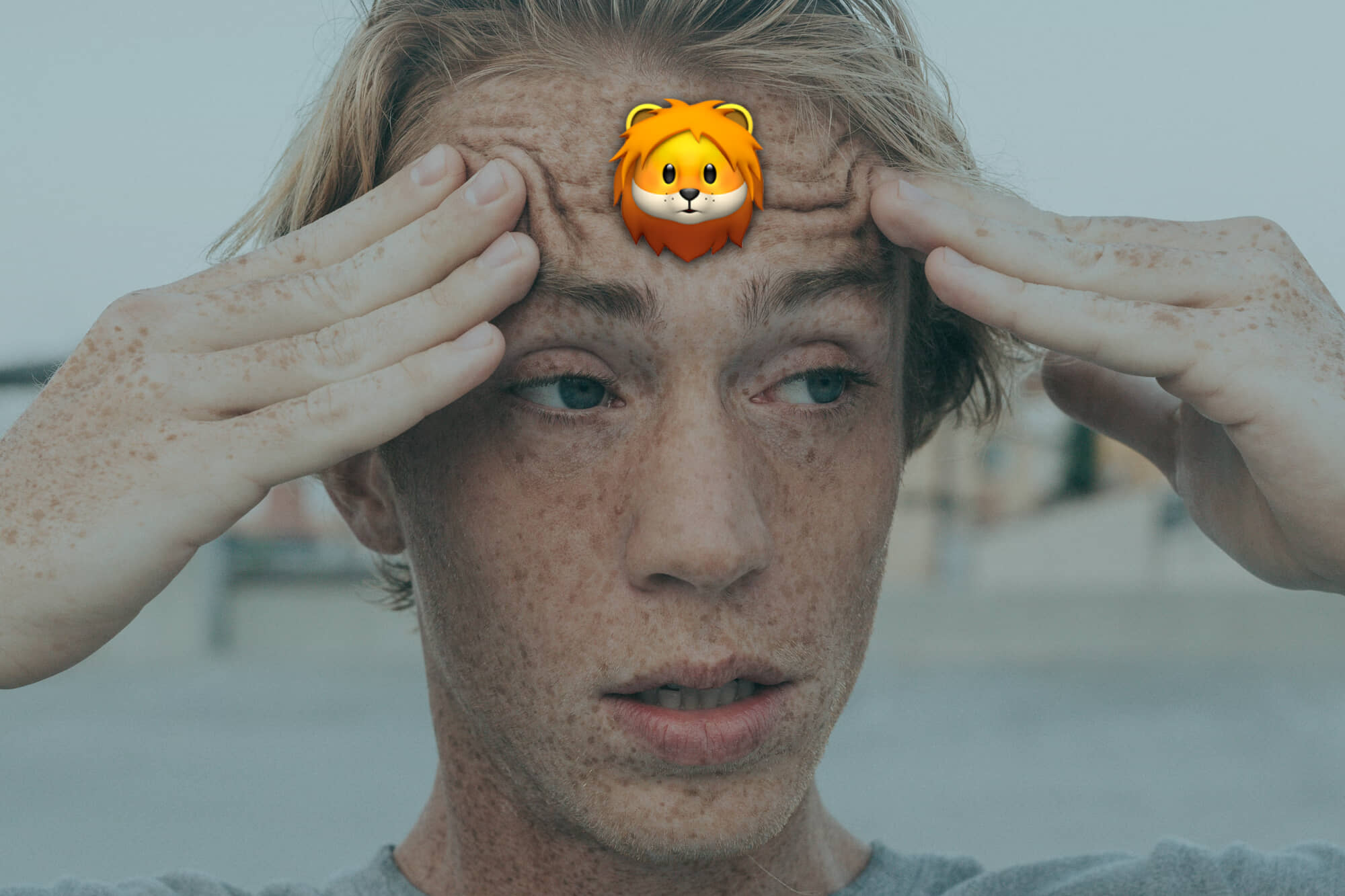 a confused man with a lion on his forehead