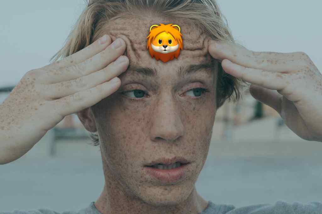 a confused man with a lion on his forehead