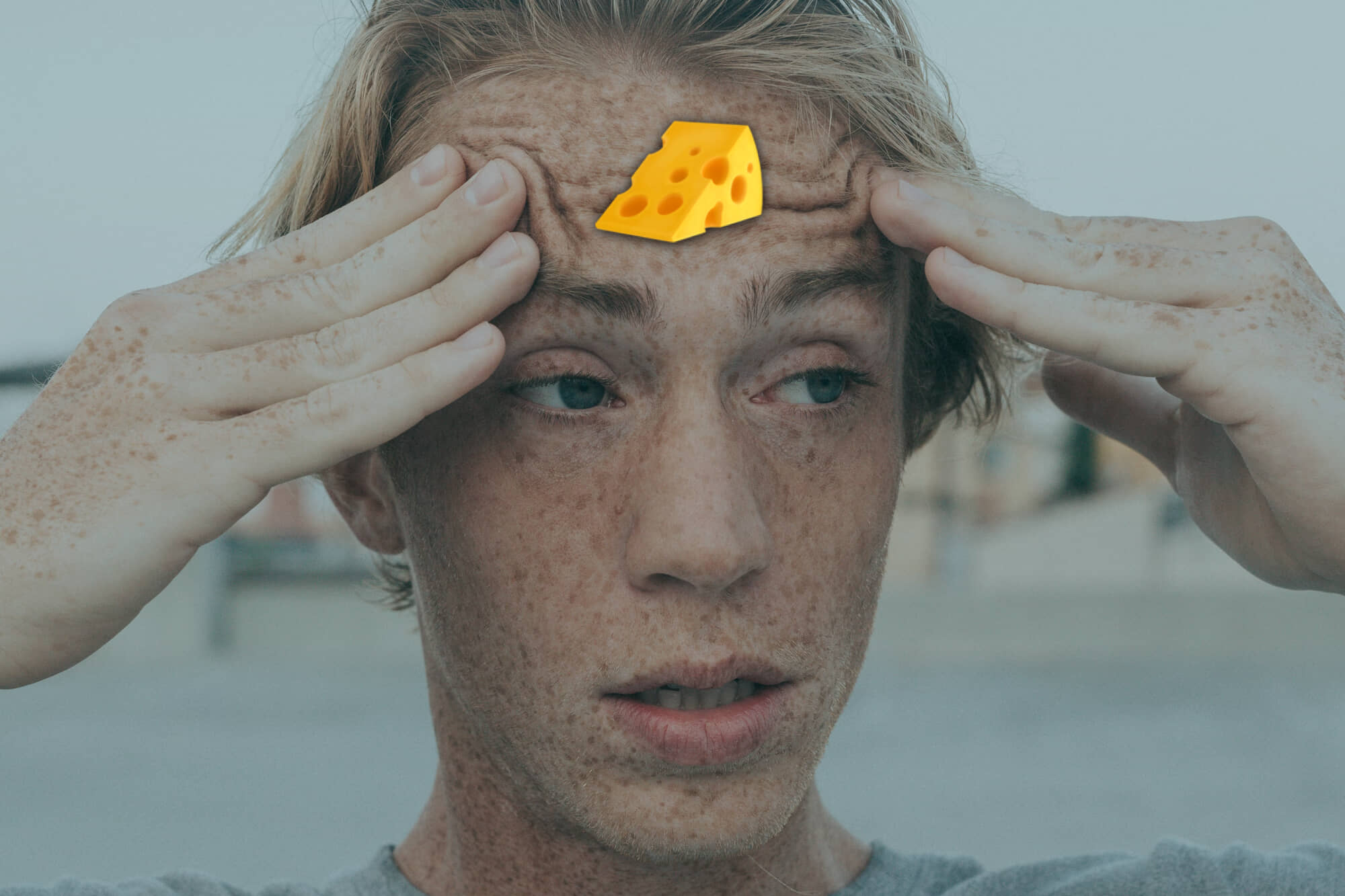 confused man with cheese on his forehead