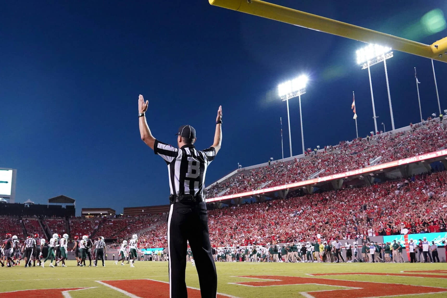 referee making a call on a football field