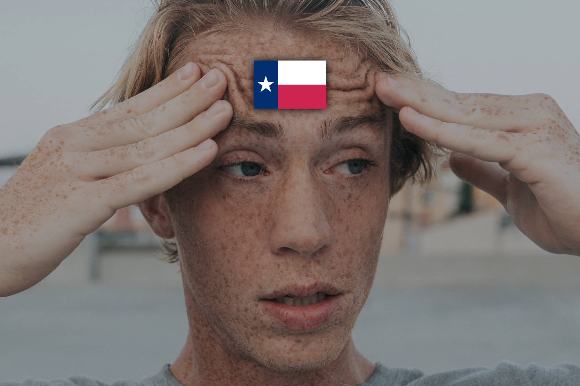 confused man with the flag of texas on his forehead